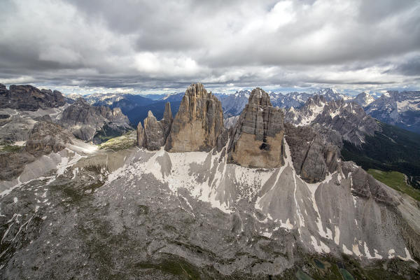 Aerial view of the Three Peaks of Lavaredo on a cloudy summer day. Dolomites. Cadore. Veneto. Italy. Europe