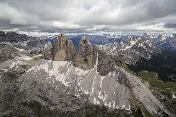 Aerial view of the Three Peaks of Lavaredo on a cloudy day. Dolomites. Cadore. Veneto. Italy. Europe
