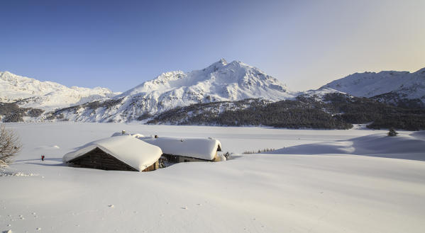 Overview portraying Spluga huts in winter near Maloja Pass. Engadine. Switzerland. Europe