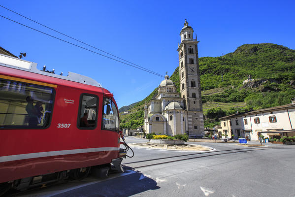 Departure of the Bernina Express from Tirano. This town situated in the center of Valtellina has been able to develop thanks to this train here brings goods from Northern Europe. Valtellina. Lombardy. Italy. Europe