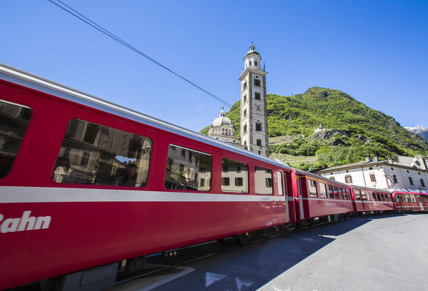 The Red Train passes to Tirano, the starting point of the Rhaetian Railway. Hence the traditional red carriages trespass in Switzerland bringing tourists in the heart of Graubünden Canton. Valtellina. Lombardy. Italy. Europe