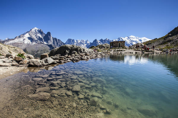 Mont Blanc and typical refuge reflect on Lac Blanc. Haute Savoie France