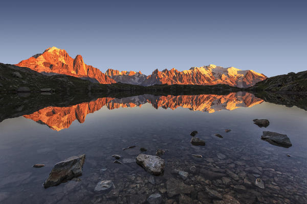 Sunset over  Lac de Cheserys. In the background the range of Mont Blanc. Haute Savoie. France Europe