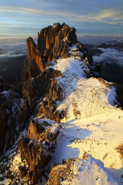 Aerial view of Sassolungo  at sunset. Sella Group Val Gardena. Dolomites Trentino Alto Adige Italy Europe