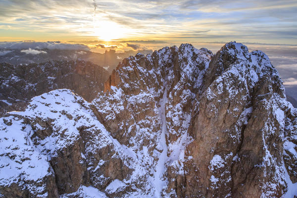 Aerial shot of Sassolungo at sunset. Sella Group Val Gardena. Dolomites Trentino Alto Adige Italy Europe