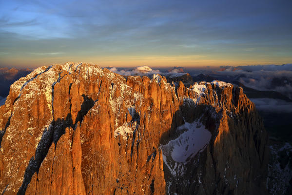 Aerial shot of Sassolungo at sunset. Sella Group Val Gardena. Dolomites Trentino Alto Adige Italy Europe