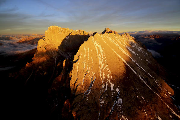 Aerial shot of Sassolungo and Sassopiatto at sunset. Sella Group Val Gardena. Dolomites Trentino Alto Adige Italy Europe