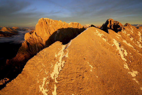 Aerial shot of Sassolungo and Sassopiatto at sunset. Sella Group Val Gardena. Dolomites Trentino Alto Adige Italy Europe