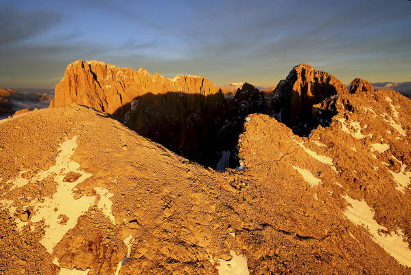 Aerial shot of Sassolungo and Sassopiatto at sunset. Sella Group Val Gardena. Dolomites Trentino Alto Adige Italy Europe