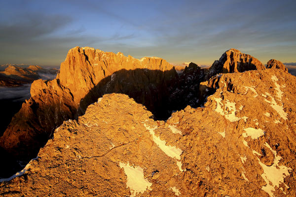 Aerial shot of Sassolungo and Sassopiatto at sunset. Sella Group Val Gardena. Dolomites Trentino Alto Adige Italy Europe