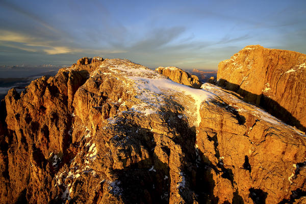 Aerial shot of Sassolungo and Sassopiatto at sunset. Sella Group Val Gardena. Dolomites Trentino Alto Adige Italy Europe