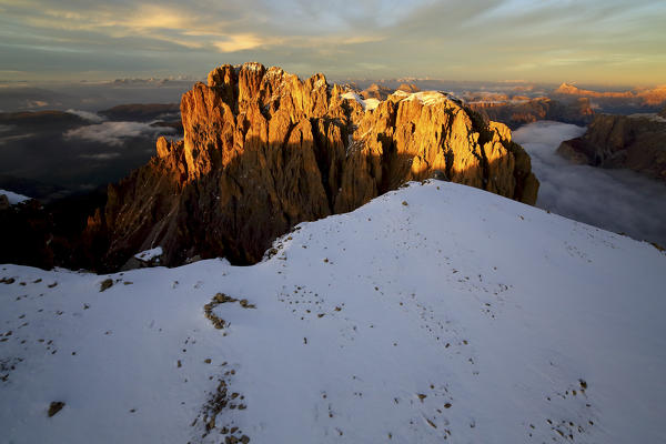 Aerial shot of Sassolungo and Sassopiatto at sunset. Sella Group Val Gardena. Dolomites Trentino Alto Adige Italy Europe