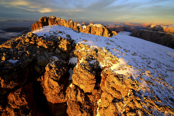 Aerial shot of Sassolungo and Sassopiatto at sunset. Sella Group Val Gardena. Dolomites Trentino Alto Adige Italy Europe