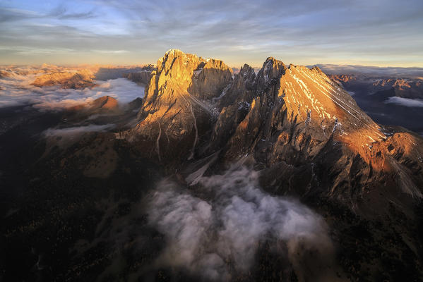 Aerial shot of Sassolungo and Sassopiatto at sunset. Sella Group Val Gardena. Dolomites Trentino Alto Adige Italy Europe