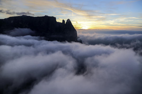 Aerial view of the high peaks at sunset. Sciliar Natural Park. Plateau of Siusi Alp. Dolomites Trentino Alto Adige. Italy Europe