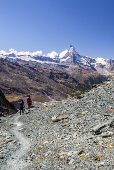 Hikers proceed towards the Matterhorn. Zermatt Canton of Valais Pennine Alps Switzerland Europe
