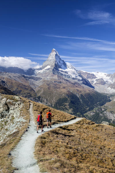 Hikers proceed towards the Matterhorn. Zermatt Canton of Valais Pennine Alps Switzerland Europe