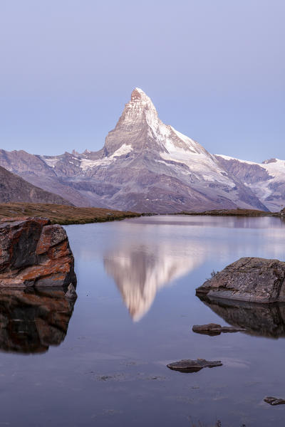 The Matterhorn reflected in Stellisee at sunrise. Zermatt Canton of Valais Pennine Alps Switzerland Europe