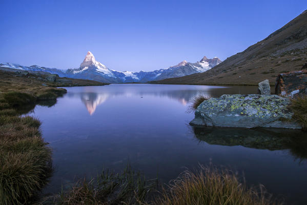 The Matterhorn reflected in Stellisee at dusk. Zermatt Canton of Valais Pennine Alps Switzerland Europe