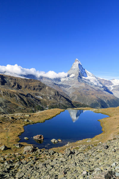 The tip of the Matterhorn is reflected in Stellisee. Zermatt Canton of Valais Pennine Alps Switzerland Europe