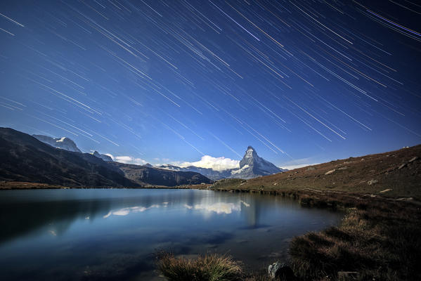 Startrail on the Matterhorn in a clear summer night. Zermatt Canton of Valais Pennine Alps Switzerland Europe