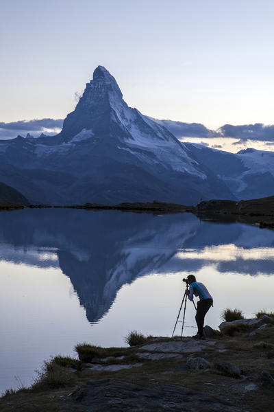 The photographer captures the Matterhorn at sunrise from Stellisee. Zermatt Canton of Valais Pennine Alps Switzerland Europe
