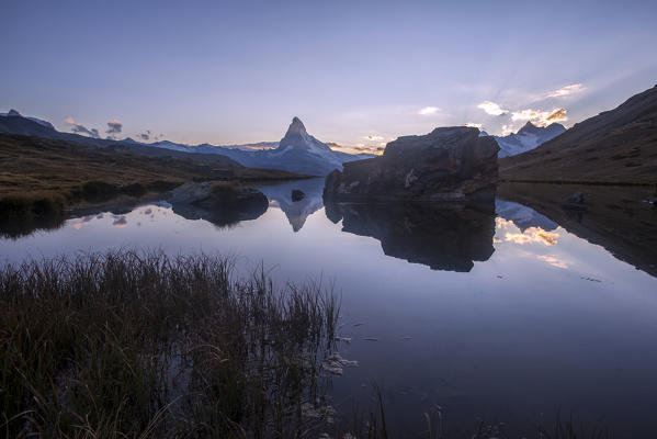 The Matterhorn reflected in Stellisee at sunset. Zermatt Canton of Valais Pennine Alps Switzerland Europe