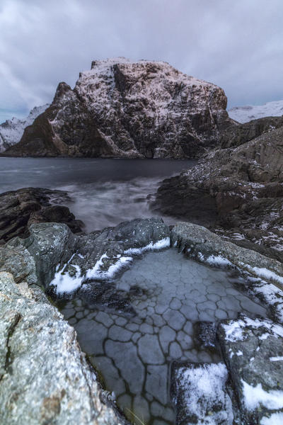 Rocks meet the cold sea. Lofoten Islands. Northern Norway. Europe