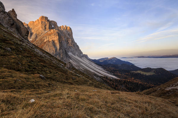 Dawn illuminates the peaks of Forcella De Furcia. Funes Valley South Tyrol Dolomites Italy Europe