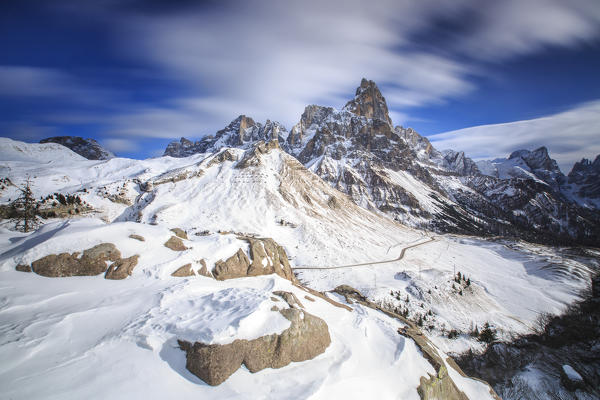Cloudy winter sky on the snowy peaks of the Pale di San Martino. Rolle Pass Panaveggio Dolomites Trentino Alto Adige Italy Europe