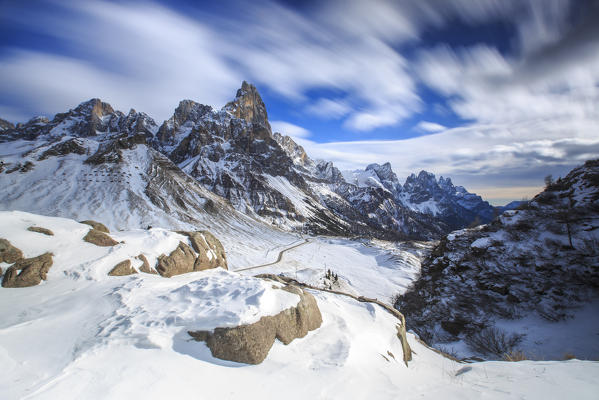 Cloudy winter sky on the snowy peaks of the Pale di San Martino. Rolle Pass Panaveggio Dolomites Trentino Alto Adige Italy Europe