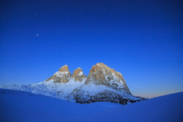 The blue dusk on Sassopiatto and Sassolungo. Dolomites. Fassa valley Sella Pass Trentino Alto Adige Italy Europe