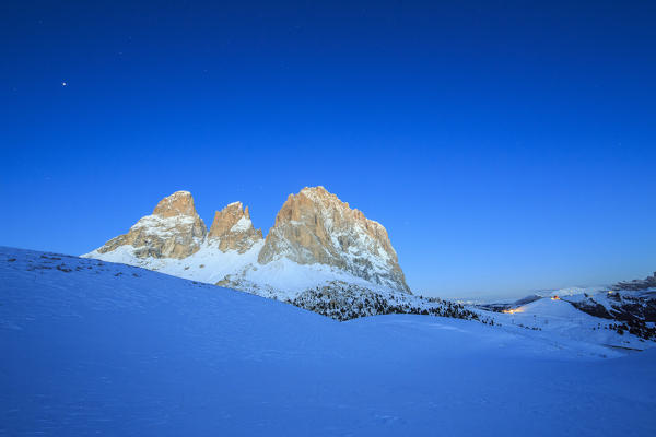The blue dusk on Sassopiatto and Sassolungo. Dolomites. Fassa valley Sella Pass Trentino Alto Adige Italy Europe