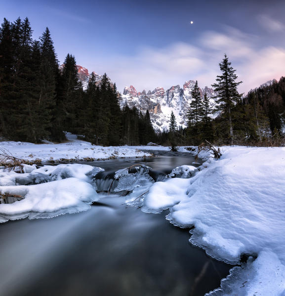 Winter sunset illuminates the  high peaks. Venagia Valley Panaveggio Natural Park Dolomites Trentino Alto Adige Italy Europe