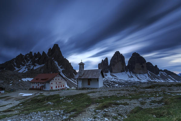 Last lights of sunset over Refuge Locatelli and the Three Peaks of Lavaredo Sesto Dolomites Trentino Alto Adige Italy Europe