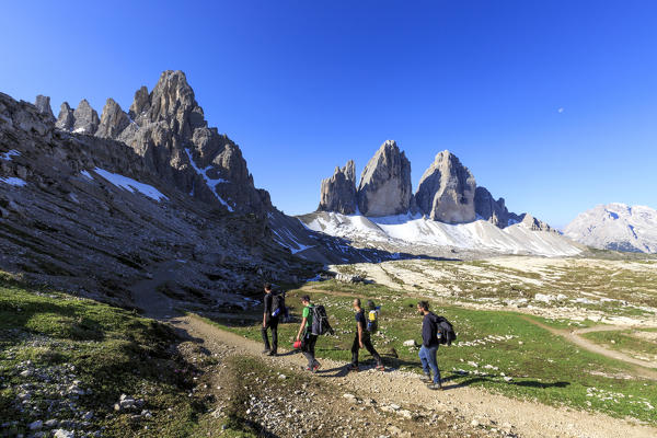 Hikers venturing to discover the Three Peaks of Lavaredo. Sesto Dolomites Trentino Alto Adige Italy Europe