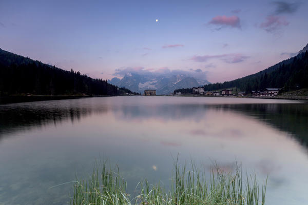 The Sorapiss mountain range is reflected in Lake Antorno at sunrise. Veneto Sesto Dolomites Italy Europe
