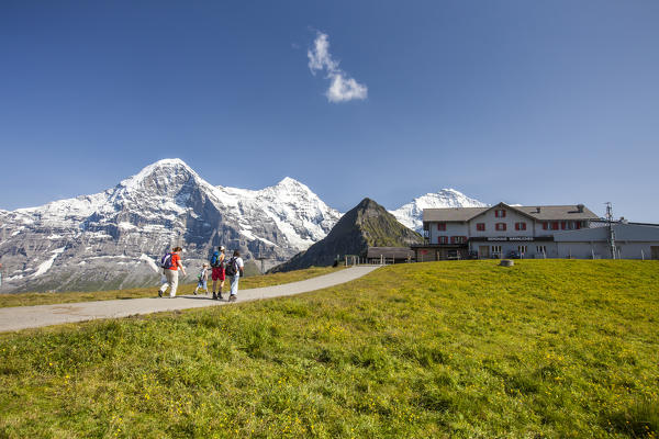Hikers walking in the background Mount Eiger Mannlichen Grindelwald Bernese Oberland Canton of Bern Switzerland Europe