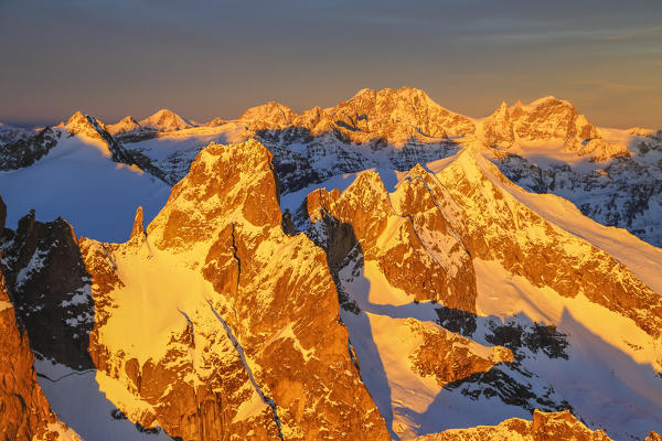 Aerial view of peaks Torrone and Bernina Group at sunset Masino Valley Valtellina Lombardy Italy Europe