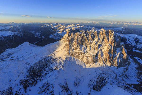 Aerial view of Sassolungo Sassopiatto and Grohmann peak at sunset. Dolomites Sella Group Trentino Alto Adige Italy Europe
