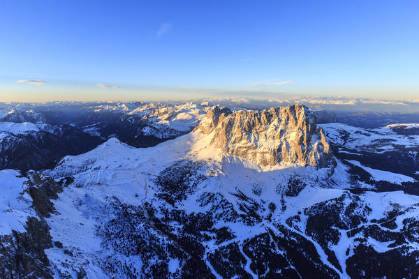 Aerial view of Sassolungo Sassopiatto and Grohmann peak at sunset. Dolomites Sella Group Trentino Alto Adige Italy Europe