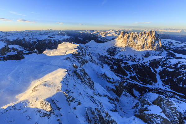 Aerial view of Sassolungo and Grohmann peak at sunset. Dolomites Sella Group Trentino Alto Adige Italy Europe