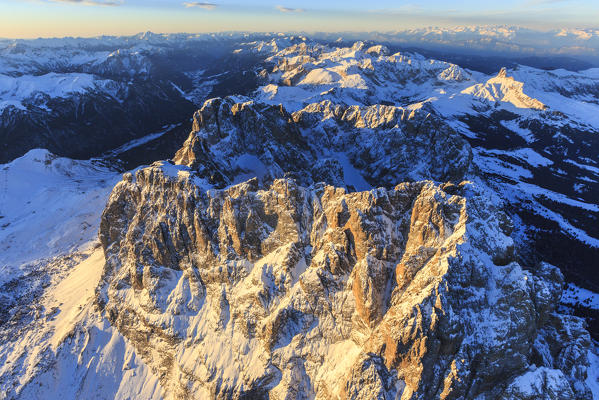 Aerial view of Sassolungo Sassopiatto and Grohmann peak at sunset. Dolomites Sella Group Trentino Alto Adige Italy Europe