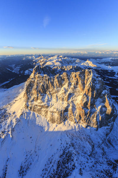 Aerial view of Sassolungo Sassopiatto and Grohmann peak at sunset. Dolomites Sella Group Trentino Alto Adige Italy Europe