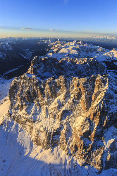 Aerial view of Sassolungo Sassopiatto and Grohmann peak at sunset. Dolomites Sella Group Trentino Alto Adige Italy Europe