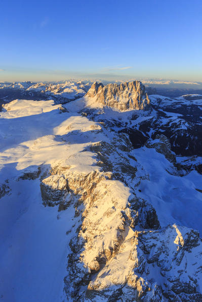 Aerial view of Sassolungo and Grohmann peak at sunset. Dolomites Sella Group Trentino Alto Adige Italy Europe