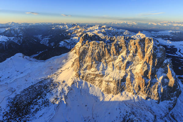 Aerial view of Sassolungo Sassopiatto and Grohmann peak at sunset. Dolomites Sella Group Trentino Alto Adige Italy Europe