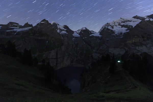 Star trail on Lake Oeschinensee Bernese Oberland Kandersteg Canton of Bern Switzerland Europe