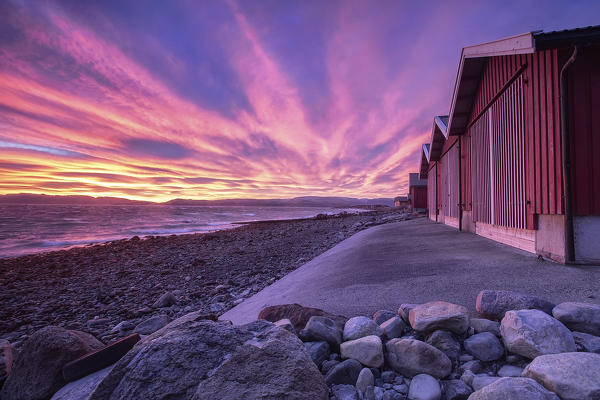 The colors of dawn light up the houses of fishermen Ørland Brekstad Trøndelag Norway Europe