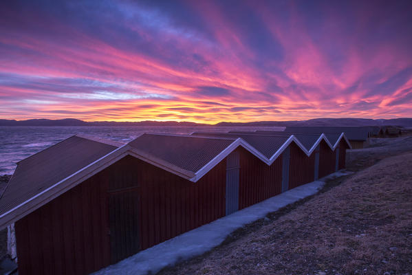 The colors of dawn light up the houses of fishermen Ørland Brekstad Trøndelag Norway Europe